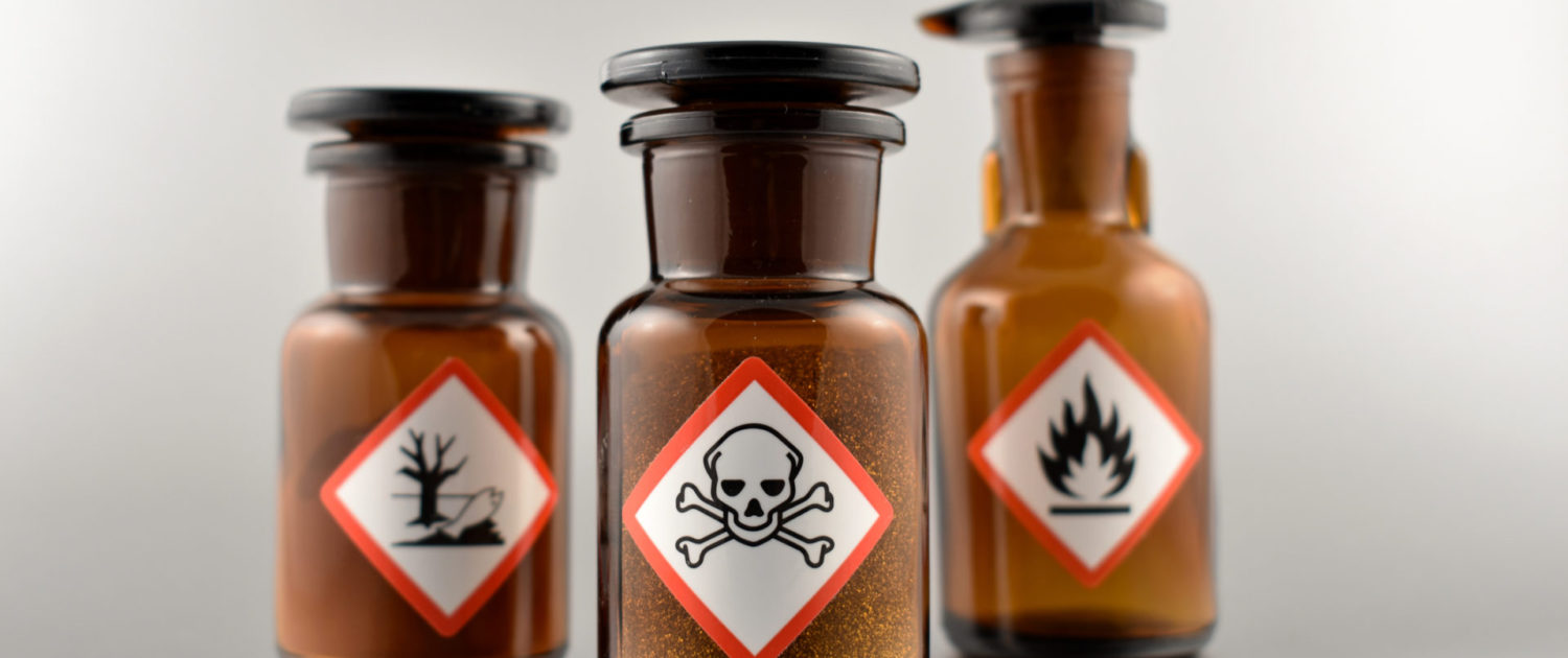 Vial with warning pictogram stock images